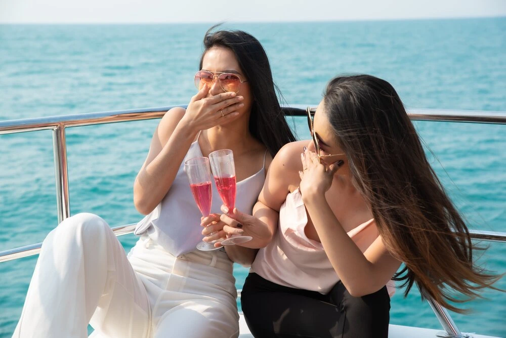 Two asian young businesswomen at the yacht in summer